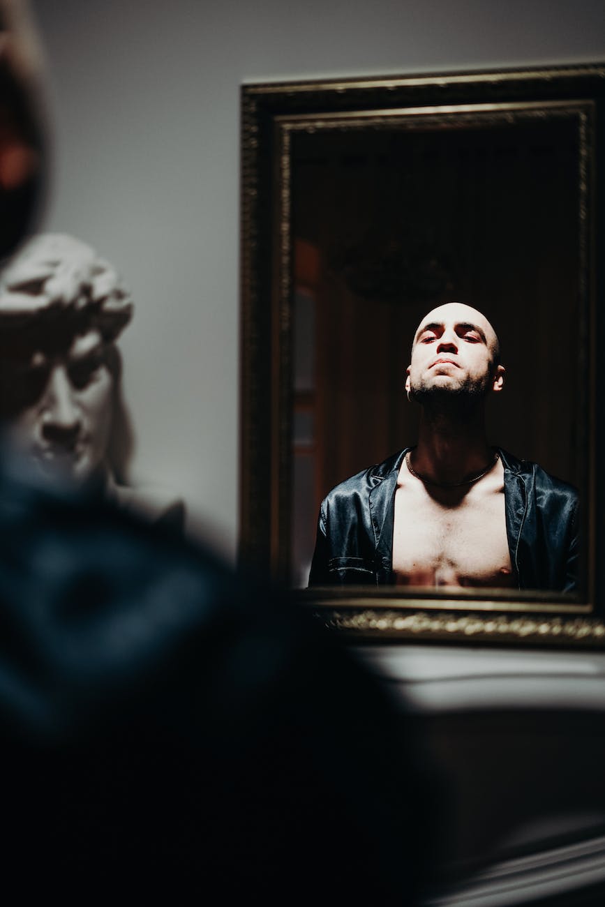 man looking on mirror