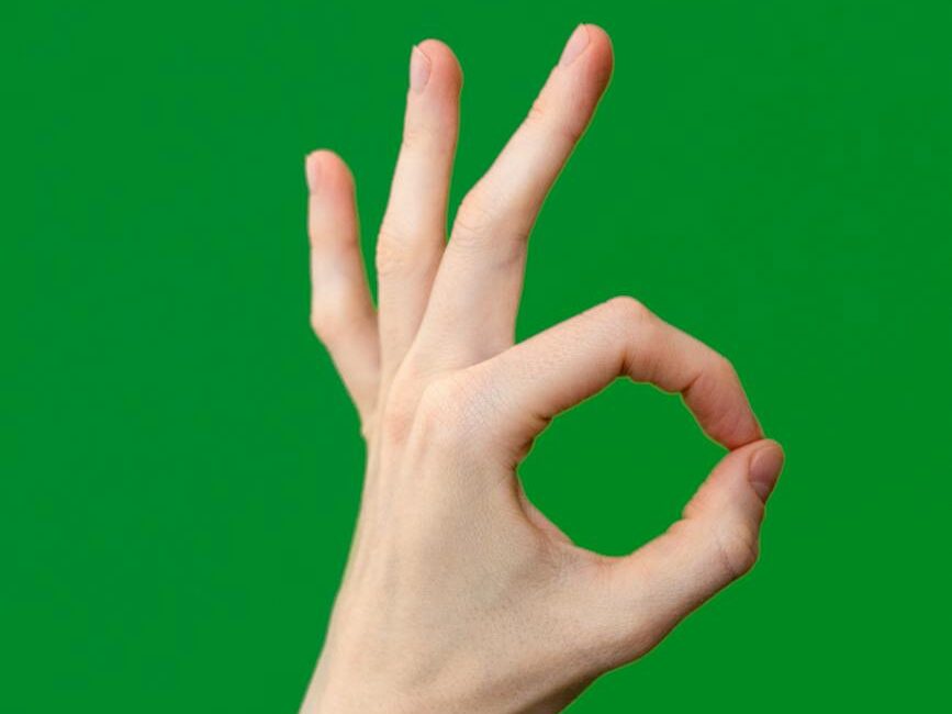a person making an ok sign with their hand