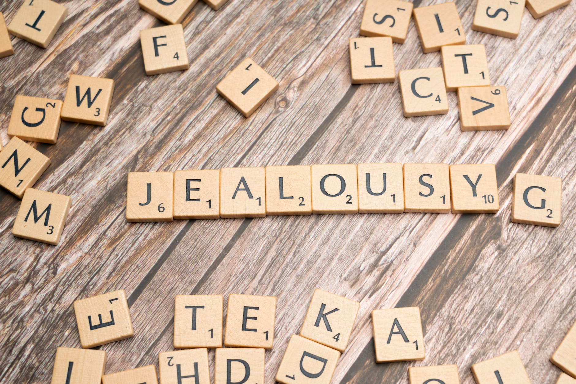 the word jealousy spelled out in scrabble letters