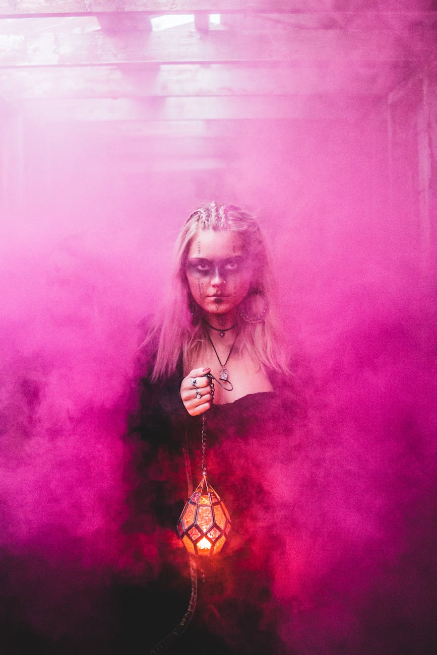 curse
spooky witch with lamp in pink smoke